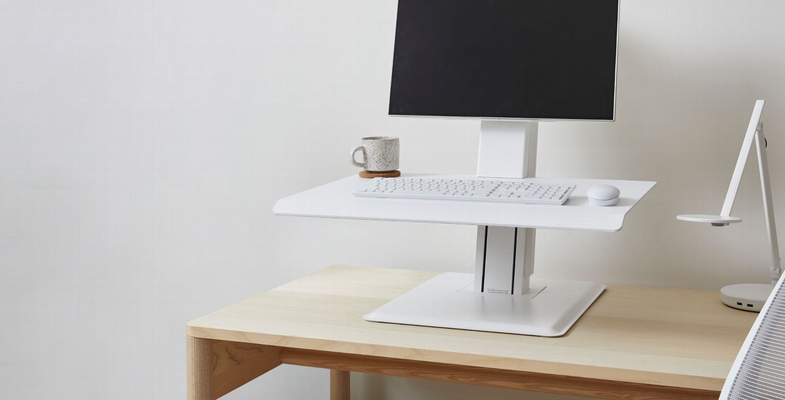 View of How to Choose a Standing Desk Converter for Your Existing Desk | Humanscale